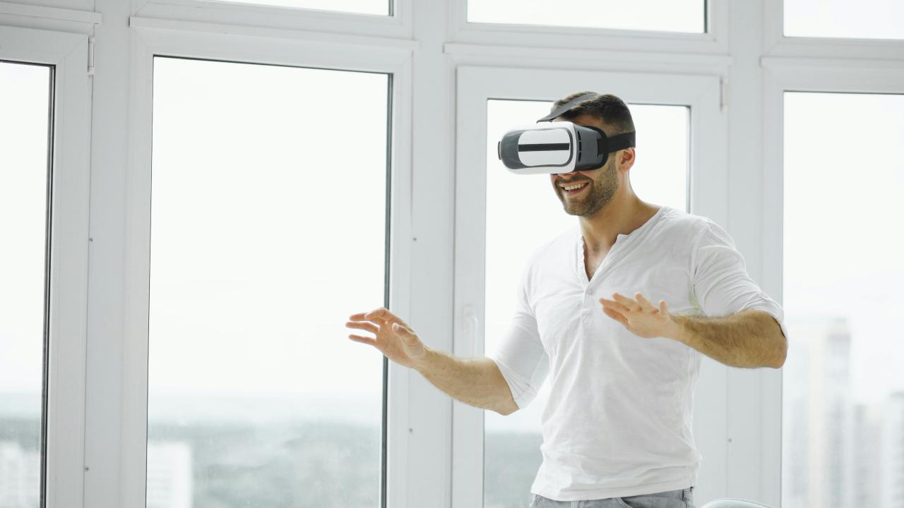 Man wearing vr headset in a bright room.
